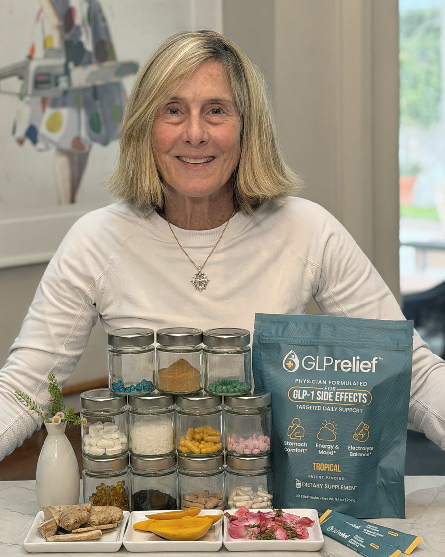 Barbara Carroll smiling at the same kitchen counter, beside a bag of GLPrelief and jars of its ingredients