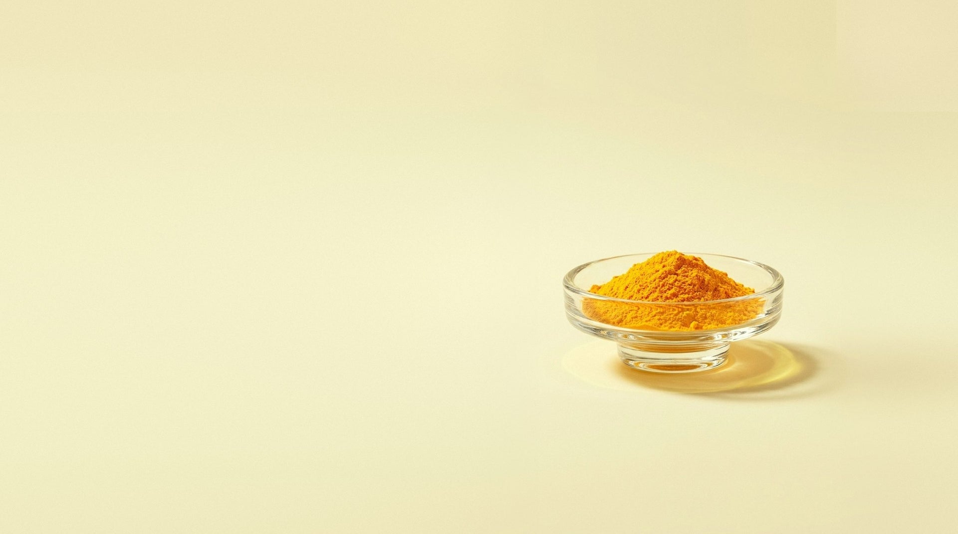 Orange-yellow riboflavin powder in a small glass dish