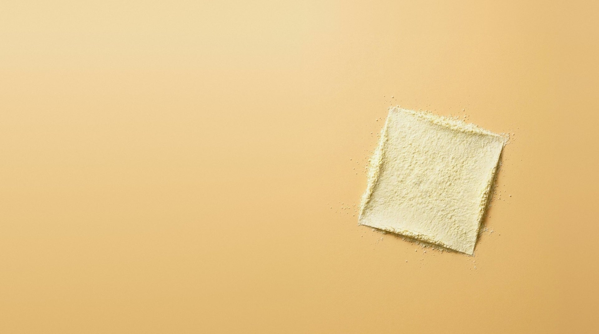 Pale yellow vitamin B6 powder pressed into a square